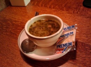 Bowl of Chicken Soup With Side of Crackers